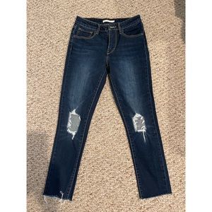 Levi’s 721 with busted knees and raw hem